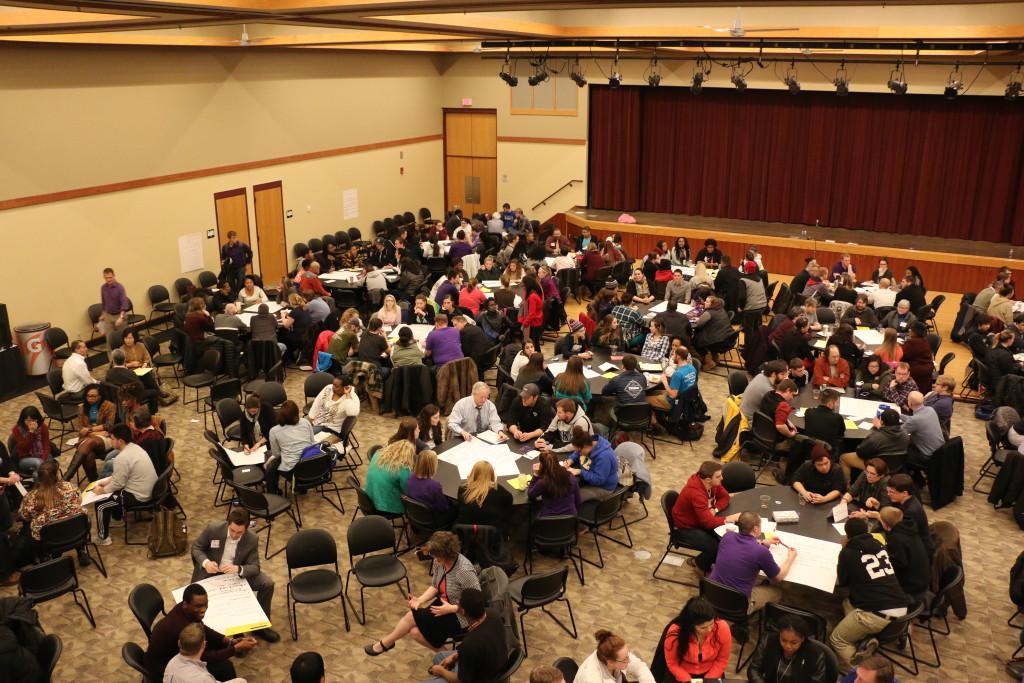 Attendees of the forum sit together in groups to discuss solutions for UW-Whitewater's campus climate issue. The room had been much fuller at the beginning of the event where students and faculty were encouraged to share their stories – close to 430 people were there.