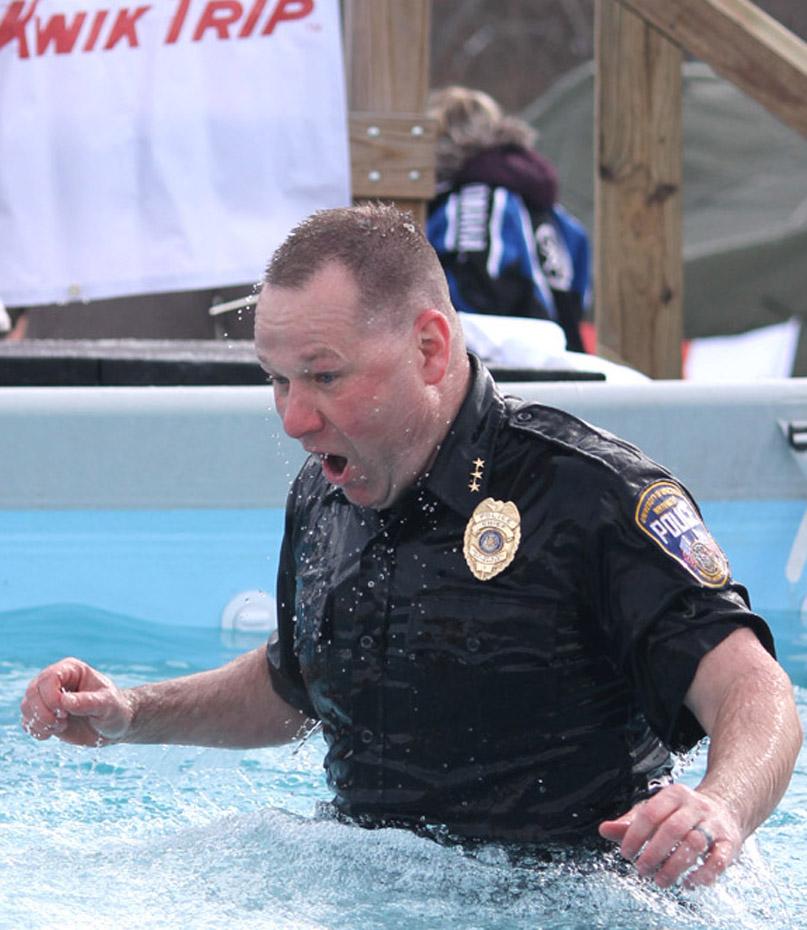UW-Whitewater Police Chief Matthew Keiderlen gasps for air after diving for the Polar Plunge “Toss your Boss” that raised more than $4,000. 