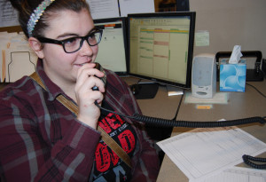 Freshman dispatcher Amy Vanderheyden radios a driver to get an update.  Vesna Brajkovic photo/ BrajkoviVA04@uww.edu