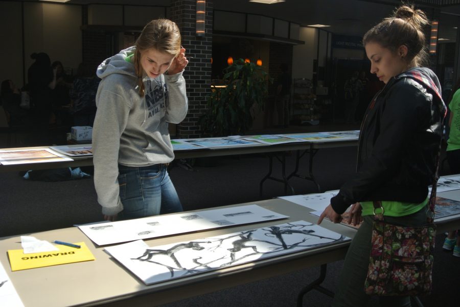 Students look over long-term projects