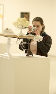 Senior student artist Marie Galvin takes a photo of a work created by Jill Dolan, ‘untitled.’