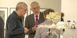 Chancellor Richard Telfer and his wife Roni along with ameritus ceramics professor Charlie Olson talk about the exhibit.