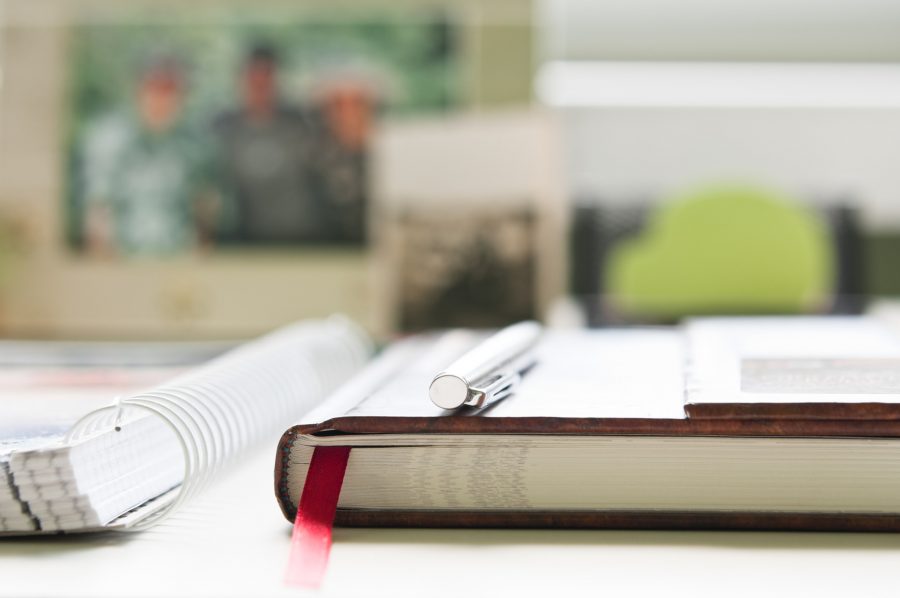 Close-up of office desk with organizer and ballpen