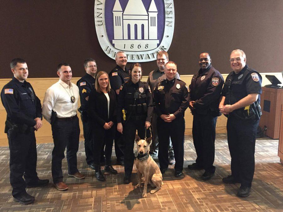 Hawk, with assistance from his partner, officer Kelsi Servi, left his inked paw-print on his official inauguration certificate at his swearing in ceremony on Feb. 1. Members of Police Services joined Hawk as he became a member of their task force. 