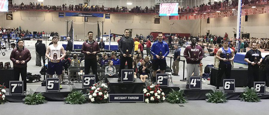 Senior+Levi+Perry+stands+atop+the+podium+after+winning+the+indoor+weight+throw+national+title+on+March+11+in+Naperville%2C+Illinois+in+the+2017+NCAA+Indoor+Track+and+Field+Championships.+Perry+was+the+first+UW-W+champion+in+the+event+since+2004+when+he+threw+a+career+best+distance.+Photo+submitted