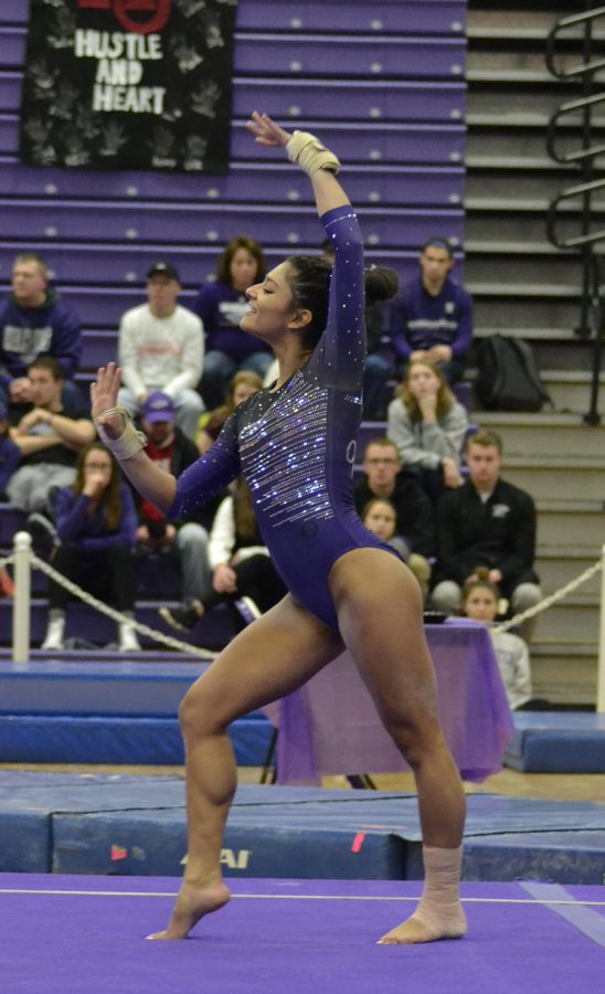 Sophomore Lisa O’Donnell poses during her floor routine during the regular-season ending victory against Hamline University (Minnesota). O’Donnell won the floor exercise competition with a score of 9.800, her season best score. Photo by Sierra High