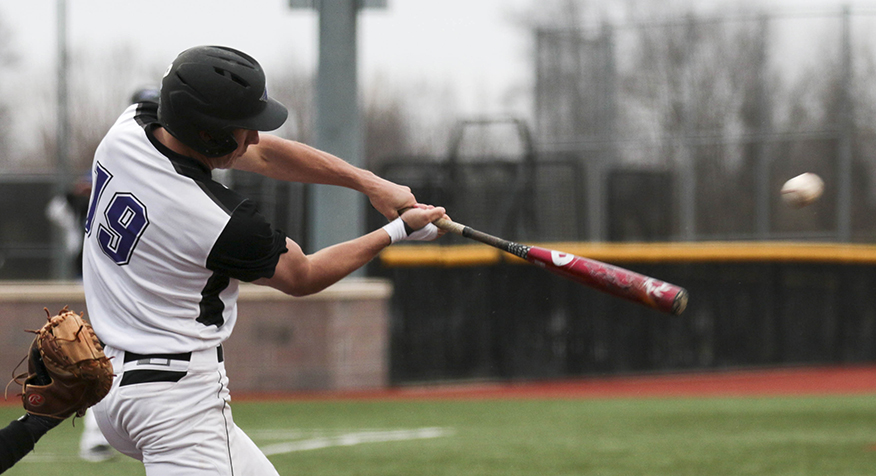 Junior outfielder Brett Krause collects a hit during the Warhawks extra-innings loss to St.Scholastica on March 29. Krause went 1-4 with two runs in the loss. Photo by Kimberly Wethal