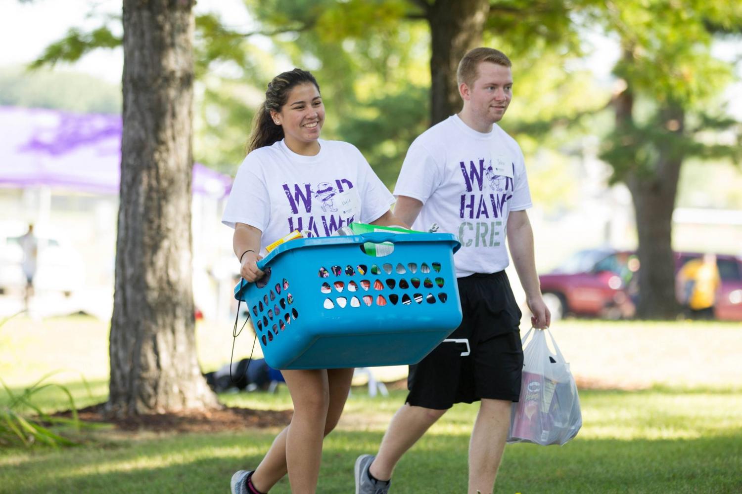Freshman ULEAD students Kayla Grzenia and John Dickenson help a fellow student in Lee Hall move in their belongings. Students at the University of Wisconsin-Whitewater moved into their residence halls on Sunday, Sept. 3. Campus leaders assisted students with unloading personal belongings from vehicles and delivering it to their rooms. 