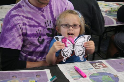 Avery Schultz-Majkrzak, 4, holds up a craft in the shape of a butterfly that she made Monday. She attended the Butterfly Project, an arts and crafts event that was a part of UW-Whitewater’s Diversity Week.
