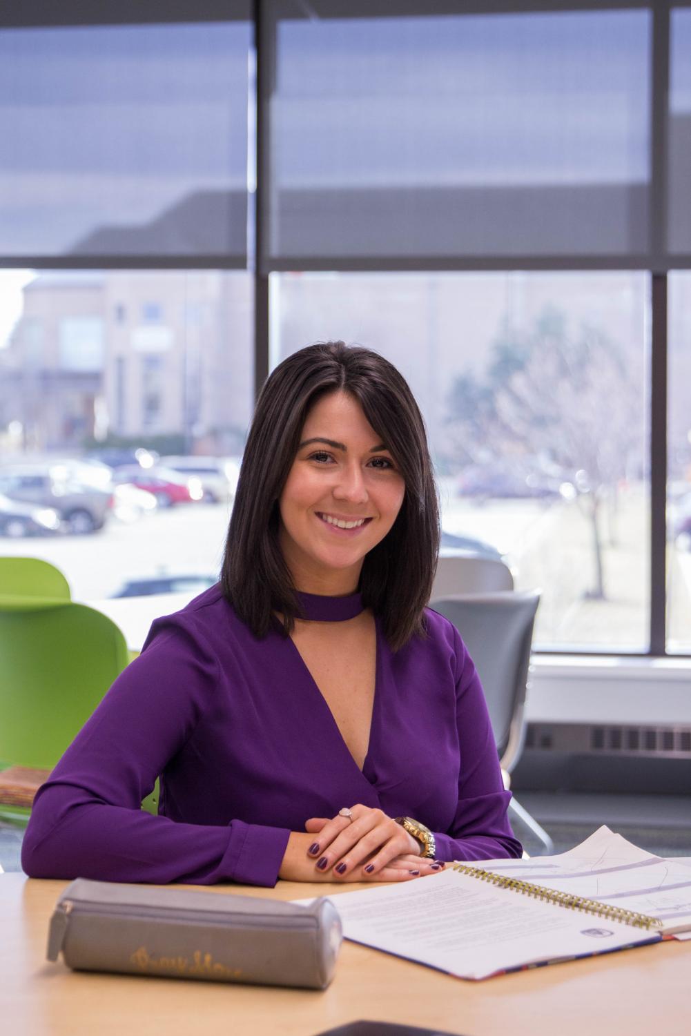 Eleana Maria Alevarez Yepez works hard in Laurentide Hall while she shares stories of her life, and how she has succeeded in becoming the Commencment speaker at the 2017 winter ceremony.