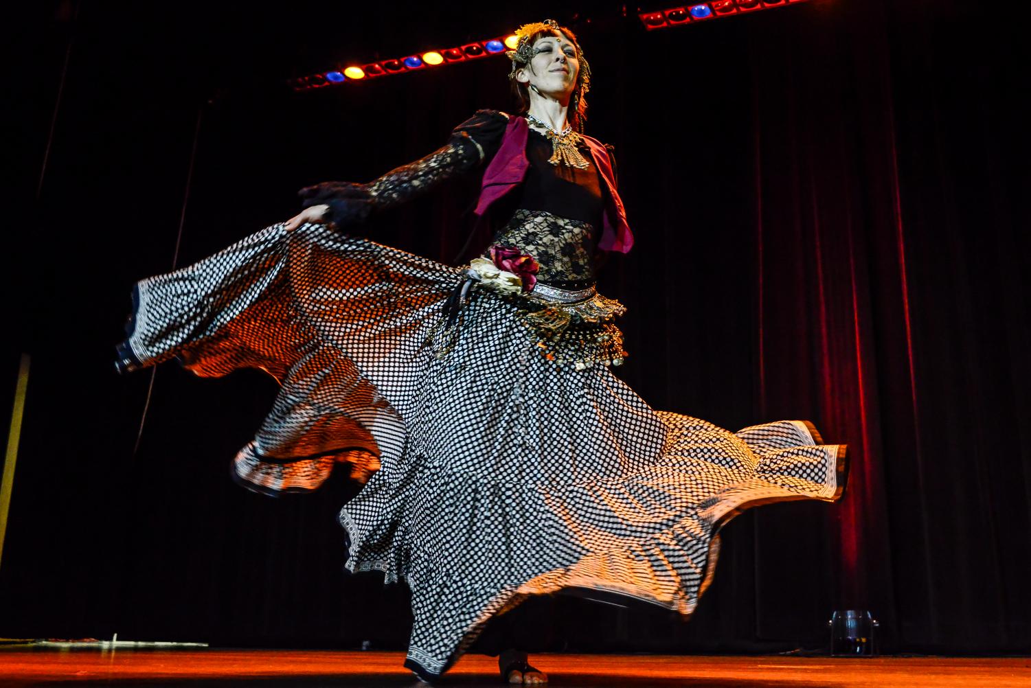 University Health and Counseling Services medical assistant Leah Jurgens dances to the tune of a mandolin. Her dress was embroidered with coins, which would make a ringing sound.