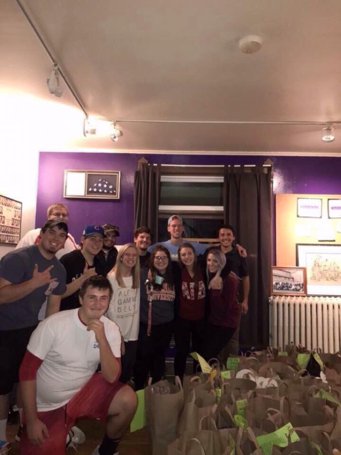 University of Wisconsin-Whitewater Greek Life students gather in the chapter room at the Lambda Chi Alpha house last fall. Students have helped organized several biannual food drives over approximately the last 10 years.