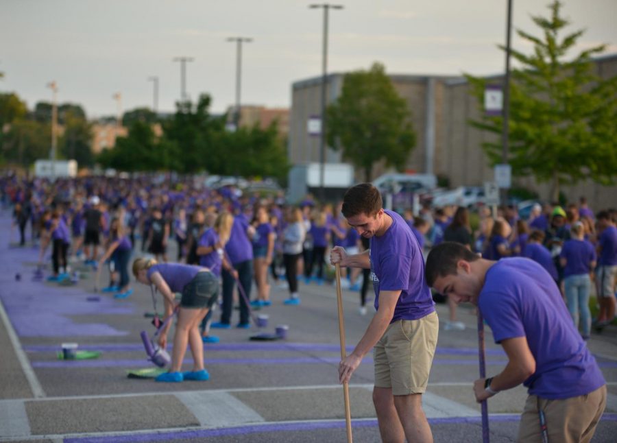 Masses of freshmen students participate in the annual Paint it Purple tradtion on campus, where new students can come
together and become a part of the Warhawk family.  