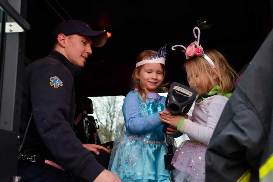 Whitewater police officer Carl Strait gives children a tour of an ambulance.