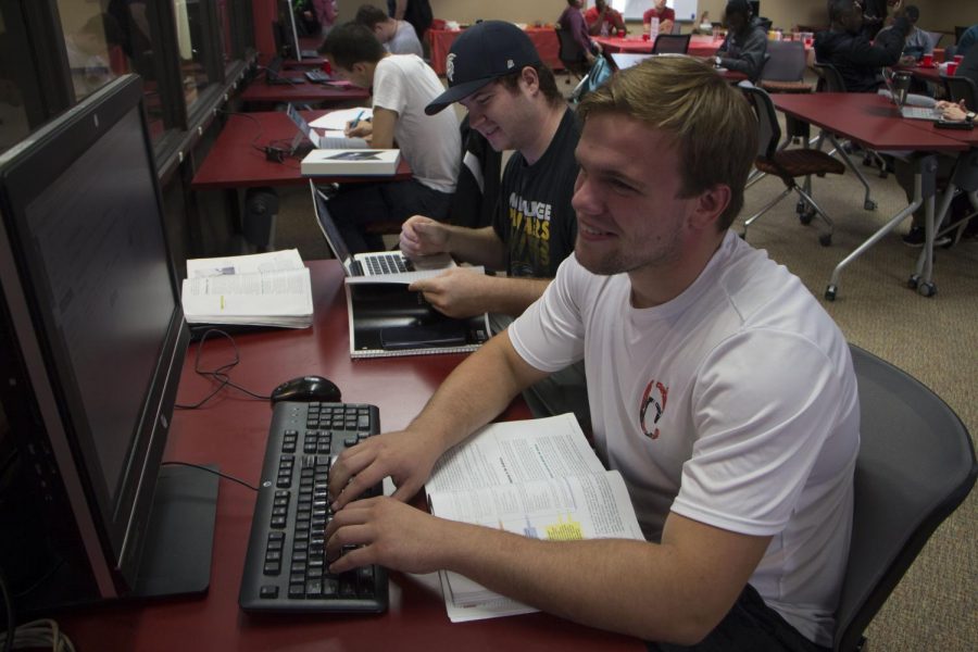 Sophomores Luke Groehler, front, and Mike Young work on assignments in Canvas during the ‘Study N’ Style’ event Sept. 24.