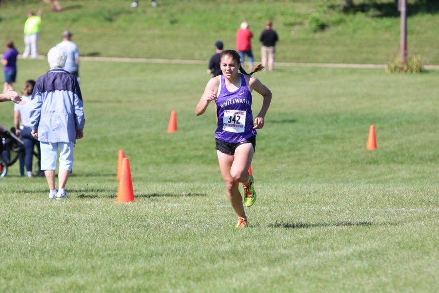 Junior Jessie Braun finishes her race Saturday, Sept. 10 at the Fifth Annual Tom Hoffman Invitational. Braun ran an official time of 24:17.8.