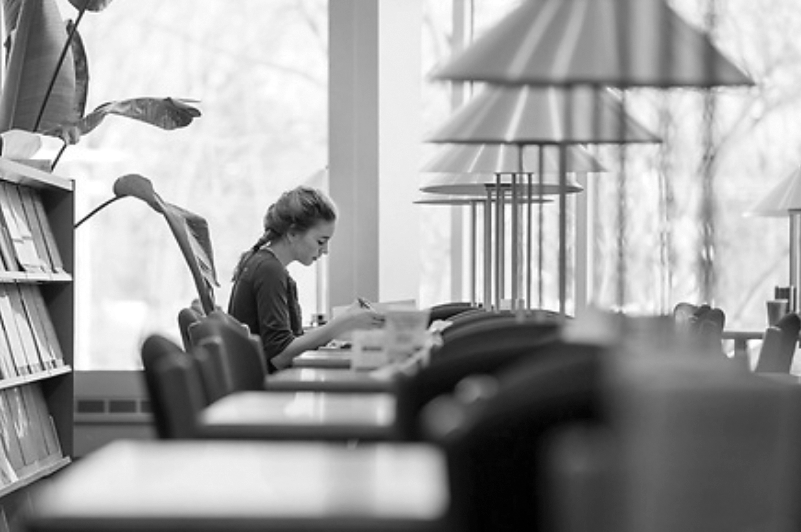 UW-Rock County student Jaimee Swanson works on her homework in the campus library.