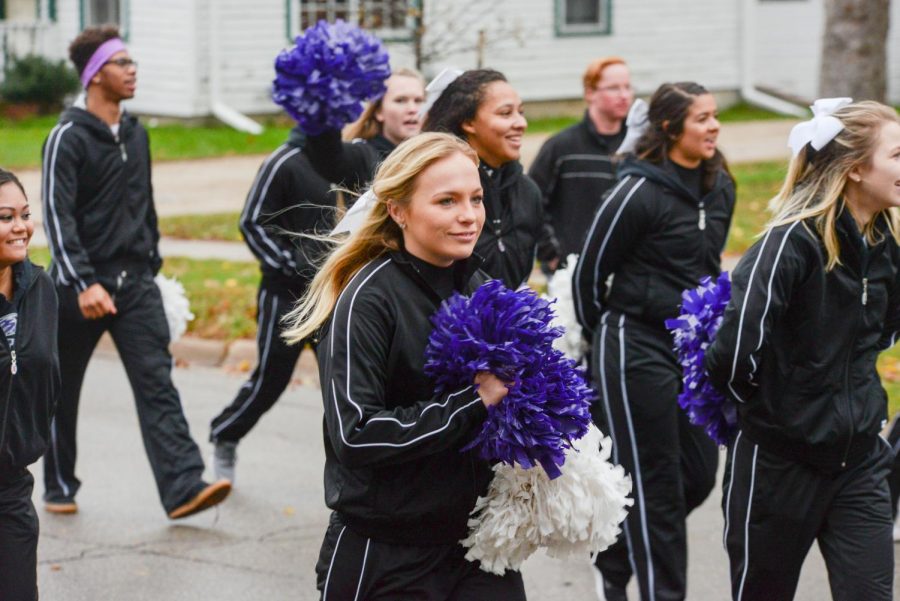 UW-Whitewater cheerleaders march in the Homecoming Parade.