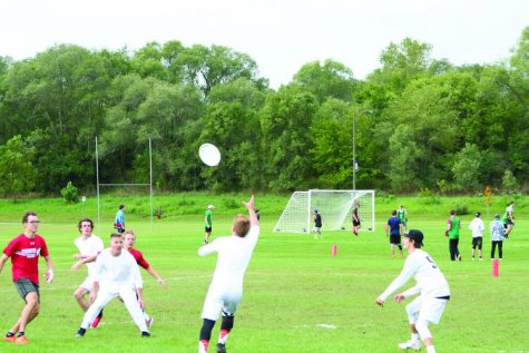 Members of the UW-Whitewater Club Ultimate Frisbee Team make a scoring play.
