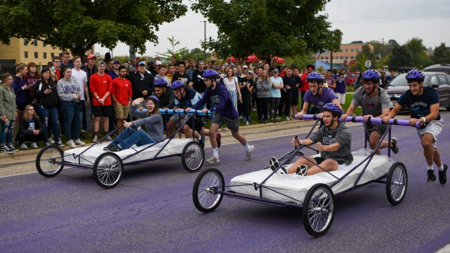Members of student organizations run in the bed races.