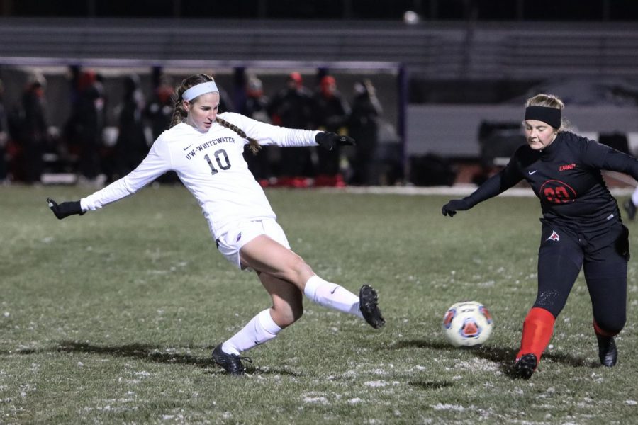  Junior forward Anna Brodjian attempts a goal kick in the semifinal game of the WIAC Conference Championship.