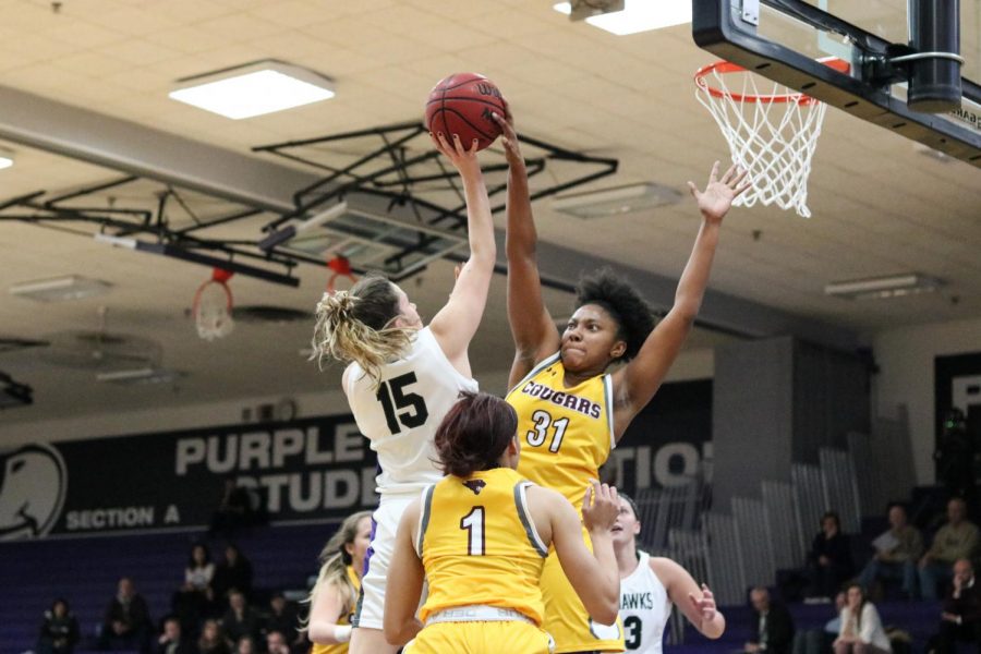 UW-W sophomore guard Veronic Kieres drives to the hoop against Concordia Chicago. The Cougars played multiple defensive fronts, trying to confuse the Warhawks. It caused turnovers, but also led to baskets.