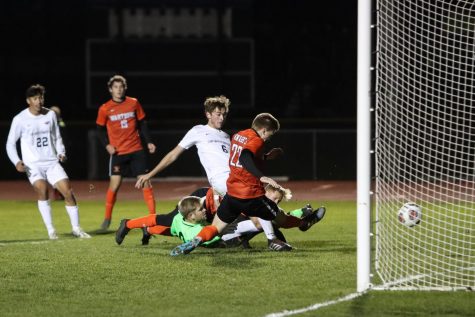 After a Goulmouth scramble, Mariano Carini puts the ball into the net for the Warhawks.
