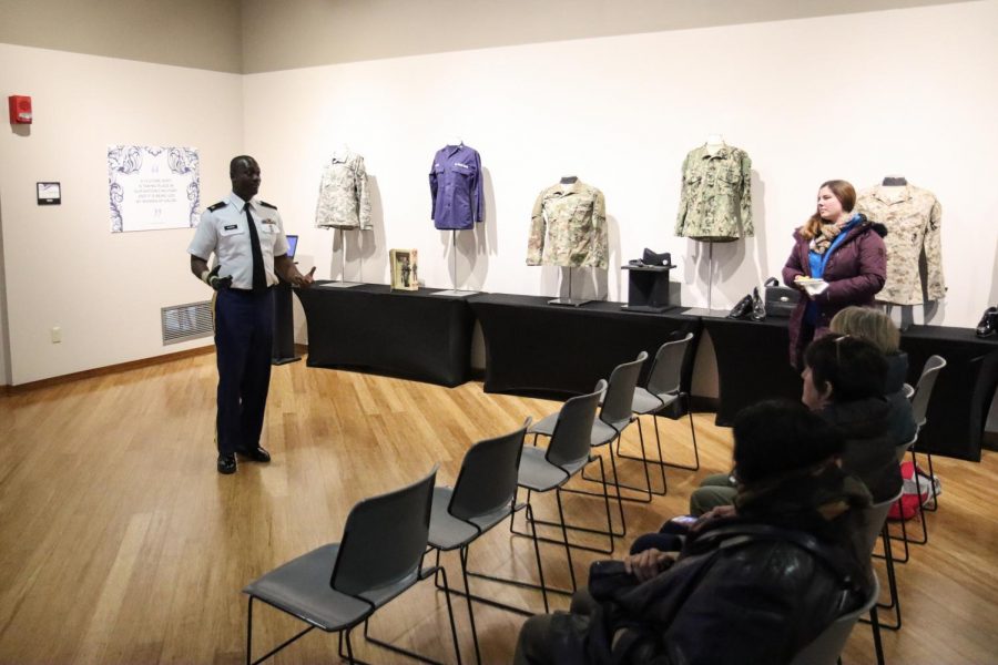 Sergeant Richard Harris delivers a presentation to 
attendees of the Women of Valor exhibit on Veteran’s Day.