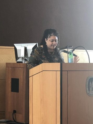 Dr. Sonya Maria Johnson explains to the audience her research about the nature of homemaking within certain circumstances among African descendants.