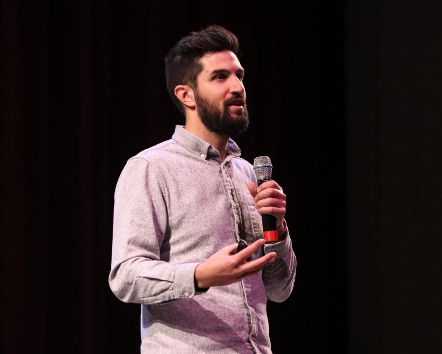 Zach Ingraci speaks during refugee lecture.