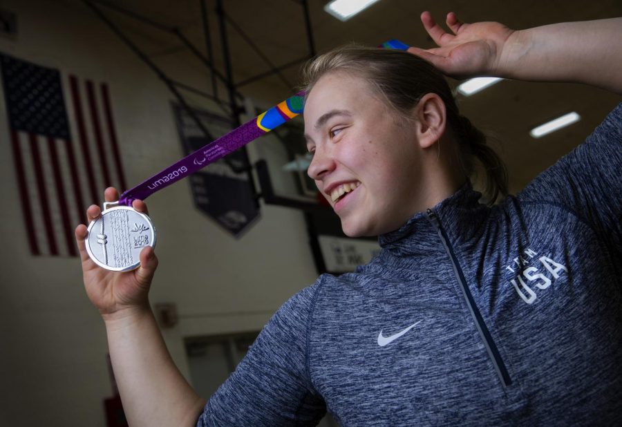 UW-Whitewater women's wheelchair basketball player Lindsey Zurbrugg is shown with the silver medal she received as a member of Team USA at the Parapan American Games in Lima, Peru, in August 2019. She will play as a Warhawk in 2019-20 and hopes to qualify again for Team USA ahead of  the 2020 Paralympic Games in Tokyo.