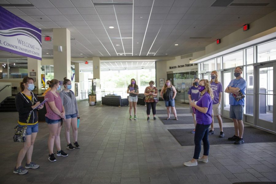 Jackie Briggs, front right in purple, Director of Admissions, leads a tour in the University Center lobby. UW-Whitewater admissions staff visited with incoming and prospective students and their families and guided small tour groups around campus on Thursday, July 16, 2020.