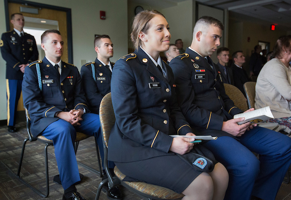 Cadets including UW-Whitewater junior Marli Kram, front, attend the commissioning ceremony for seniors Ethan Christensen and Adam Earle.  The Warhawk Company, Army Reserve Officers Training Corps at UW-Whitewater held its spring commissioning ceremony for two seniors prior to commencement on Saturday, May 13, 2017.  (UW-Whitewater photo/Craig Schreiner) DIGITAL MANIPULATION OF PHOTOGRAPHS OTHER THAN NORMAL MINIMAL CROPPING AND TONING IS PROHIBITED., CREDIT PHOTOS: UW-WHITEWATER PHOTO/CRAIG SCHREINER