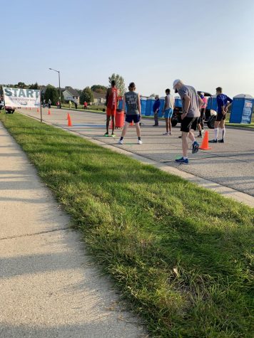 Runners warm up at the starting line of the Discover Whitewater series.