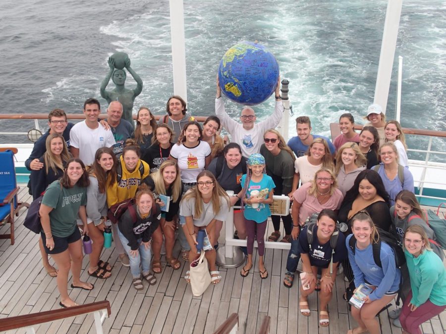 UW-W communication professor Susan Wildermuth snaps a group photo of her students and faculty members in the Semester at Sea program last spring. 