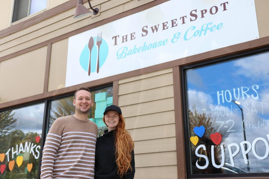 Elena+Schleusner+and+Jacob+Gildemeister%2C+new+Owners+of+both+the+Sweetspot+Bakehouse+and+Sweetspot+Cafe+stand+outside+their+business+for+a+photo+on+Friday+Sept.+18+in+Whitewater+Wisconsin.+%0A