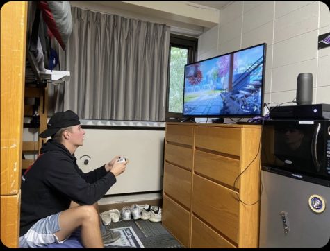 UW-WHITEWATER student plays competitive video games inside with his online friends