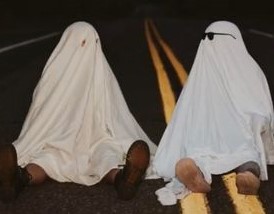 A photo taken by @maggiekraser from Tik Tok of her and her friend participating in the #GhostPhotoshoot trend.