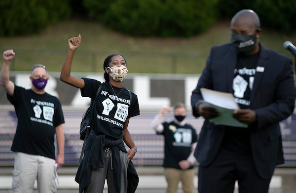 Students and staff show a gesture of unity during the closing ceremony. From left are Interim Chancellor Greg Cook, Black Student Union President Rahenya Anderson, a sociology major from Milwaukee, and Assistant Vice Chancellor of Equity, Diversity and Inclusion Kenny Yarbrough. The UW-Whitewater 2020 Unity Walk for Black Lives Matter honored the theme of unity while observing safety measures like face coverings and social distancing on Tuesday, Sept. 15, 2020. Groups limited to 10 people set out on walks throughout the afternoon and early evening around the perimeter of campus. (UW-Whitewater photo/Craig Schreiner)