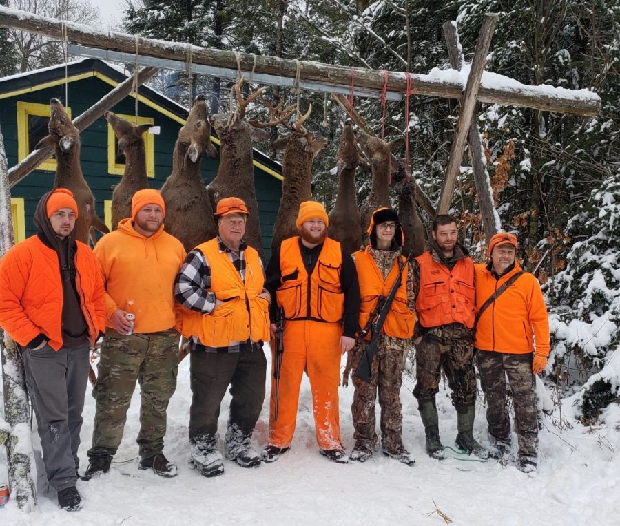 Jake Schumacher and his hunting party enjoy the rewards of a successful 2019 deer gun season hunt in Park Falls, Wisconsin. 