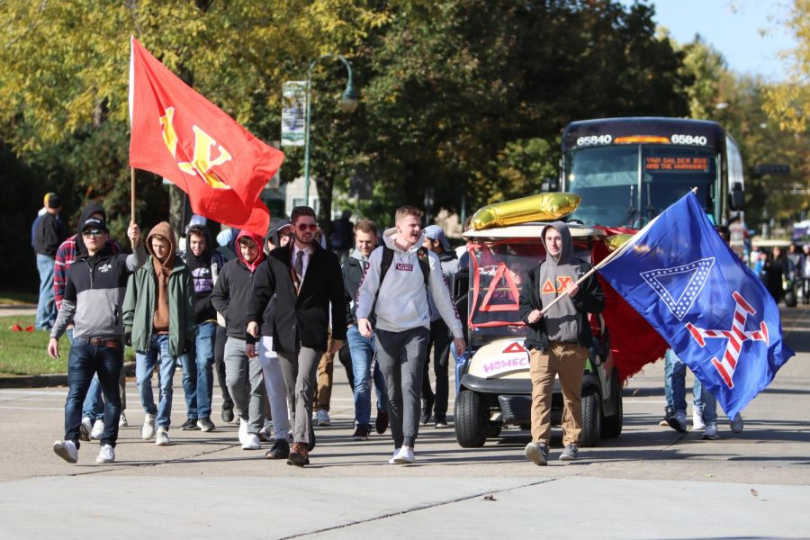 Delta+Chi+Fraternity+marches+in+the+UW-Whitewater+2019+Homecoming+Parade.+