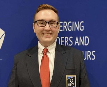 Devontae Sisk, Wisconsin Collegiate DECA State President, poses for a picture at the International Career Development Conference in Atlanta, Georgia in March after earning his new title as president.