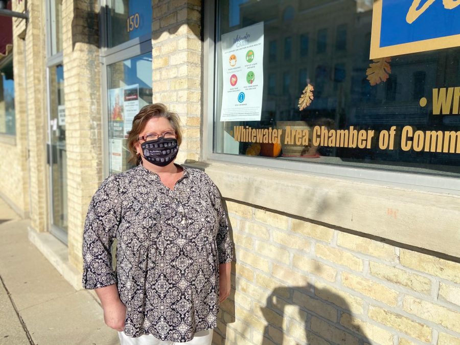 Executive Director of the Whitewater Area Chamber of Commerce and Tourism Council Kellie Carper stands outside the office on Main street Nov. 12 encouraging safe shopping this holiday season. 
