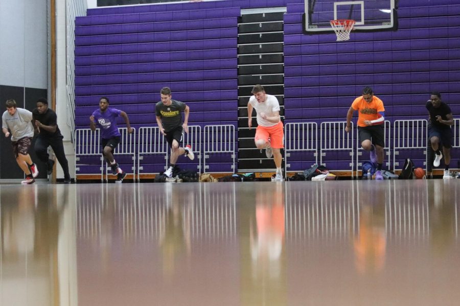 UW-Whitewater club basketball team members run across the Kachel Gymnasium floor during a
team practice in November of 2019.