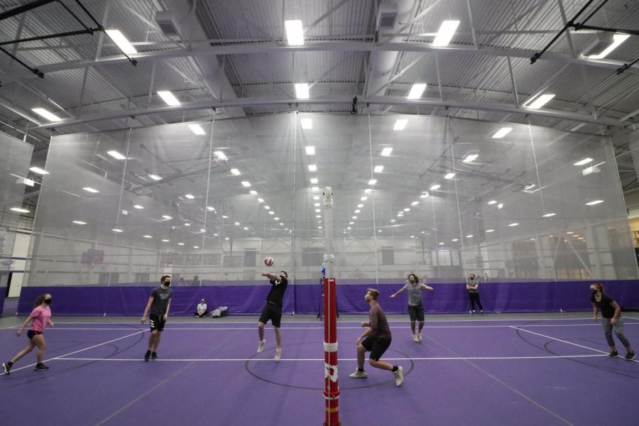 UW-Whitewater students participate in an intramural volleyball playoff match inside the Kachel Fieldhouse.