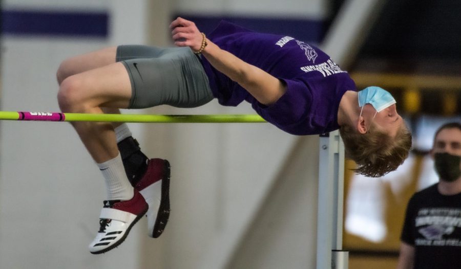 Quinn Halversen competes in the high jump during an intrasquad track & field meet inside the
Kachel Fieldhouse on Saturday Jan. 23.