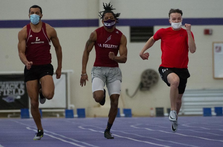 Oren Henderson-Zintz (left), Carl Wesley Jr. (center) and Nick Andersen sprint side-by-side
while competing in an intrasquad track & field meet inside the Kachel Fieldhouse on Saturday
Jan. 23.