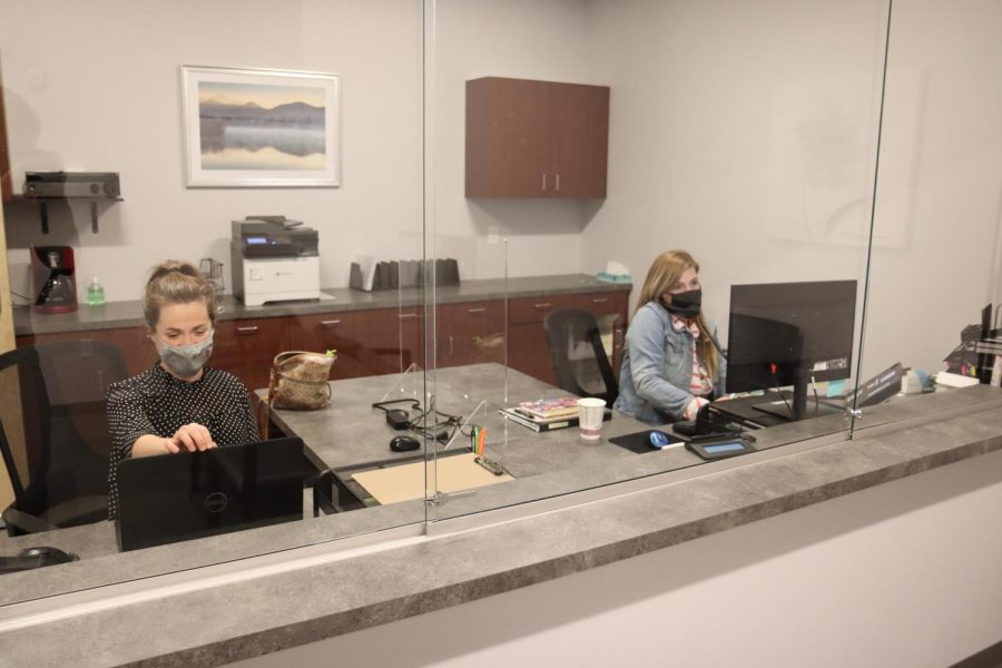 Client services Manager Danielle Sarver (left) and client services representative Penelope
Kinsman sit at the front desk of the Pauquette Center for Psychological Services & Family Counseling in the Innovation Center at Whitewater University Technology Park. 