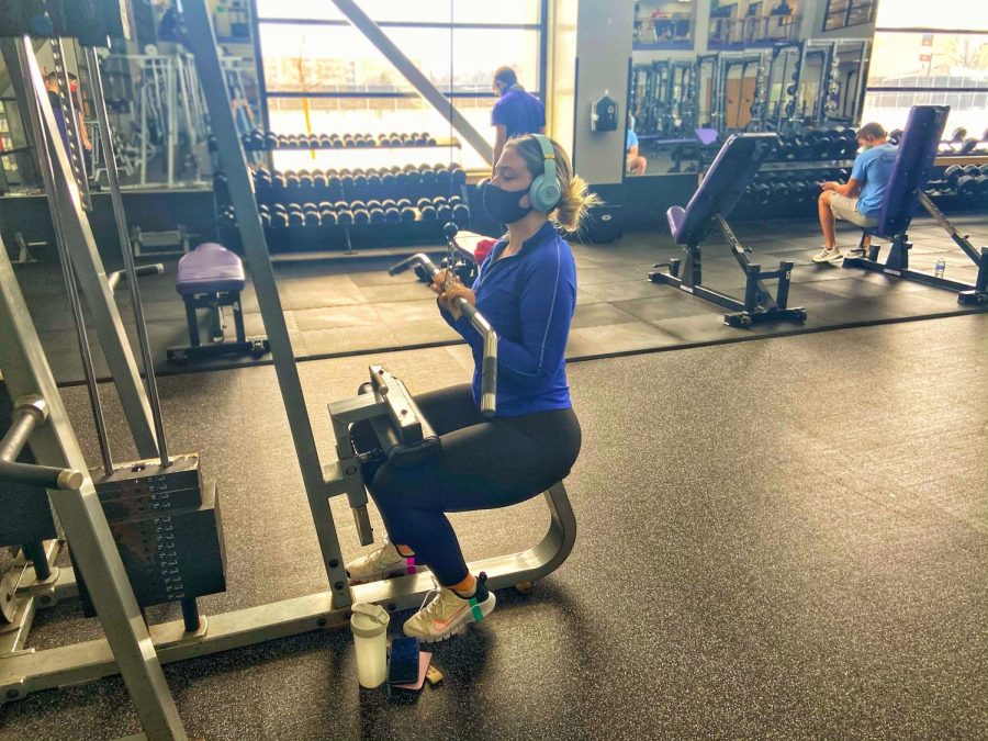 Caroline Casey works out inside the Williams Center weight room.