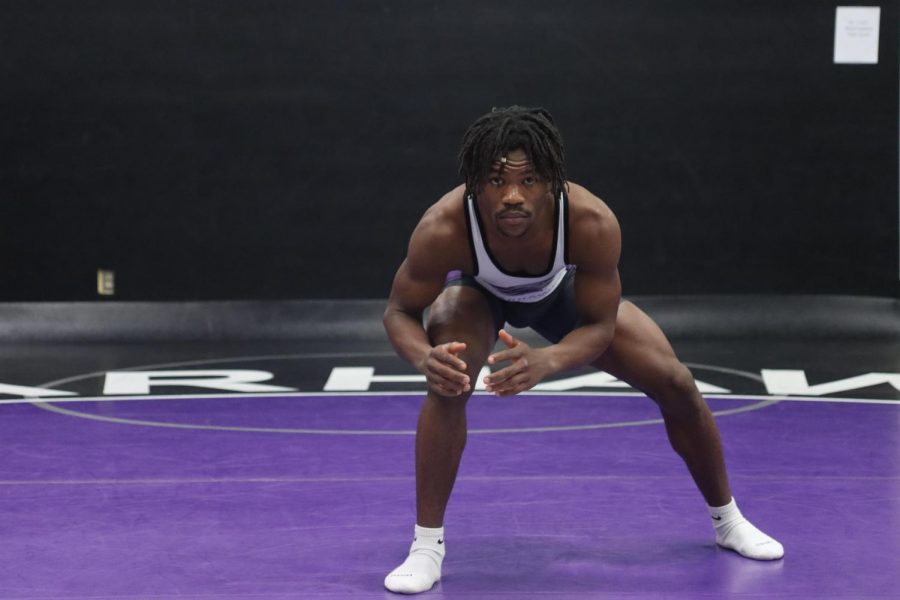 Sophomore on the University of Wisconsin-Whitewater wrestling team Dakarai Clay, holds a
wrestling stance for a photo inside the Myers family wrestling gymnasium.